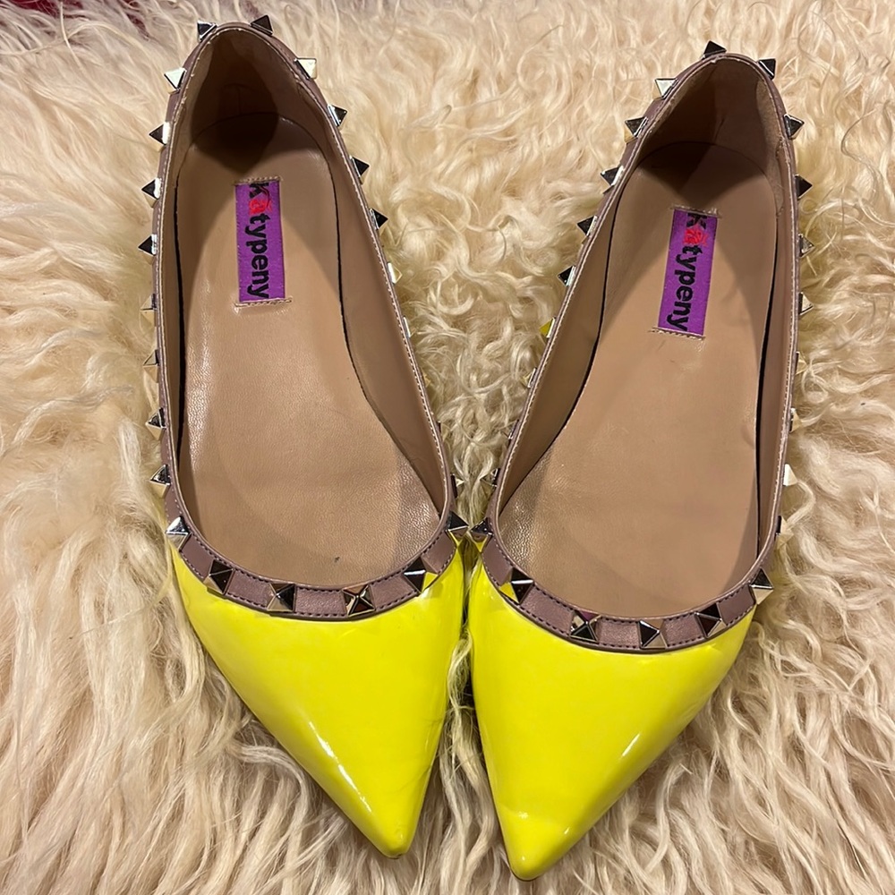 Bright yellow studded flats